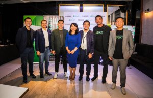 DICT Director Emmy Lou Delfin (middle) and Project Development Officer III Carlos Albornoz (fifth from left) join the executives of BlockchainSpace and Smart during the press conference announcing the partnership.